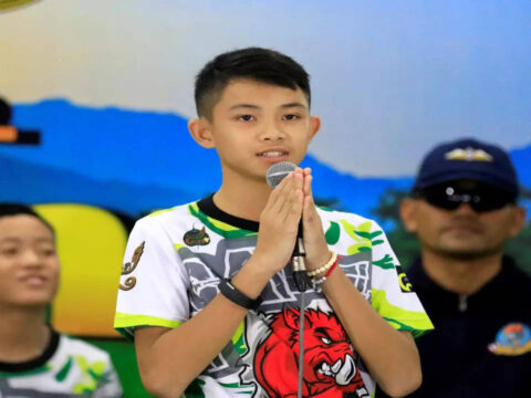 Teenager who survived Thai cave rescue dies in Britain