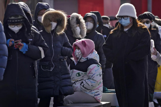 China says 200 million treated, pandemic 'decisively' beaten