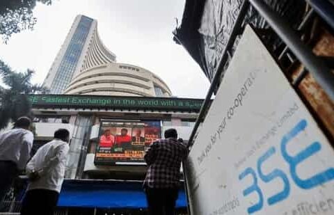 Market updates: People walk past the Bombay Stock Exchange building in Mumbai. (Reuters)