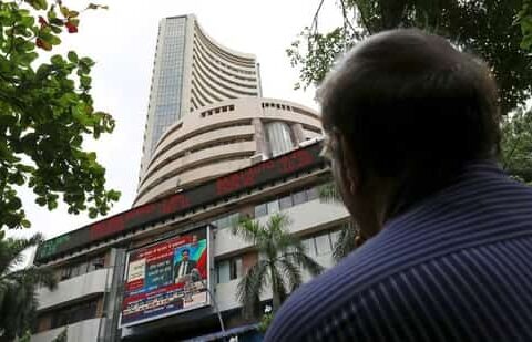 A man looks at a screen across a road displaying the Sensex on the facade of the Bombay Stock Exchange (BSE) building in Mumbai, India. (File image)(REUTERS)