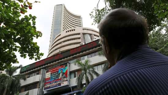 A man looks at a screen across a road displaying the Sensex on the facade of the Bombay Stock Exchange (BSE) building in Mumbai, India. (File image)(REUTERS)