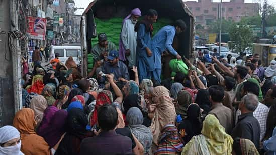 Pakistan's Prime Minister Shehbaz Sharif announced to provide free flour to the needy people during the Ramadan in the wake of country's soaring inflation. (AFP)