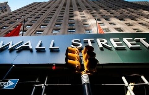 A sign for a Wall Street building is shown, (AP file photo)