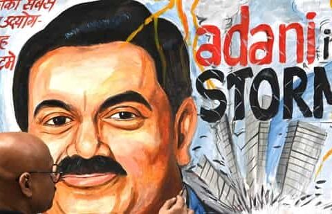 Art teacher Sagar Kambli gives final touches to a painting of Gautam Adani highlighting the ongoing crisis of the Adani group.