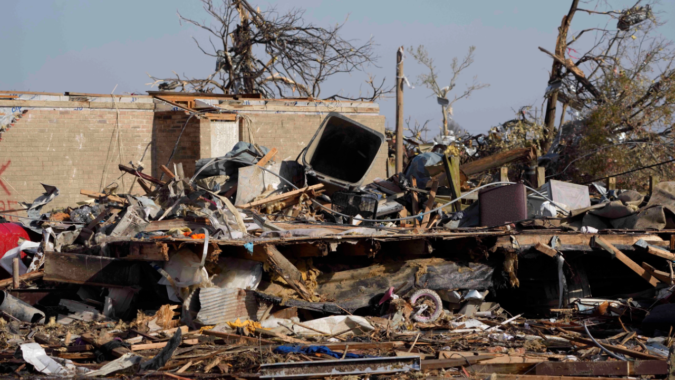 Biden declares emergency as crews dig through storm wreckage