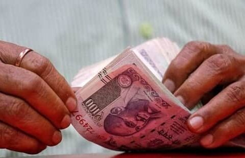 A man counts Indian currency notes inside a shop in Mumbai. The Indian rupee on Thursday had closed at 71.03 against the US dollar.(REUTERS)