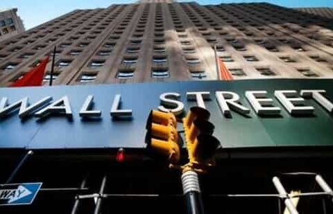 A sign for a Wall Street building is shown, (AP file photo)