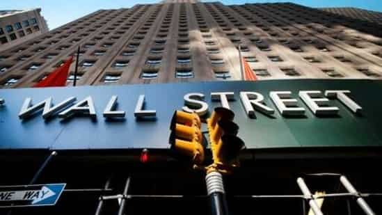 A sign for a Wall Street building is shown, (AP file photo)