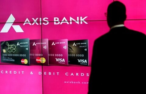 A visitor watches an Axis Bank's advertisement at its corporate headquarters in Mumbai, India July 25, 2017. REUTERS/Danish Siddiqui/File Photo(REUTERS)