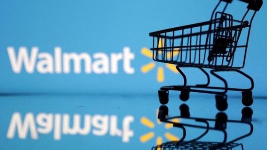 Shopping trolley is seen in front of Walmart logo.(REUTERS)