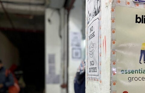 FILE PHOTO: A delivery person leaves a dark store of the SoftBank-funded Blinkit, an Indian company which is offering 10 minute deliveries for groceries, in New Delhi, India, January 19, 2022. (REUTERS/Anushree Fadnavis)