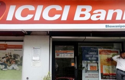 A man speaks on the phone outside an ICICI Bank branch in Kolkata, India. (REUTERS/Used only for representation)