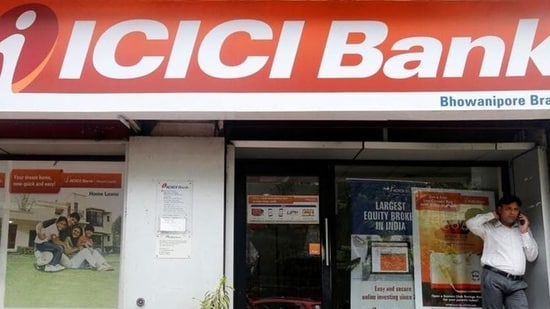 A man speaks on the phone outside an ICICI Bank branch in Kolkata, India. (REUTERS/Used only for representation)