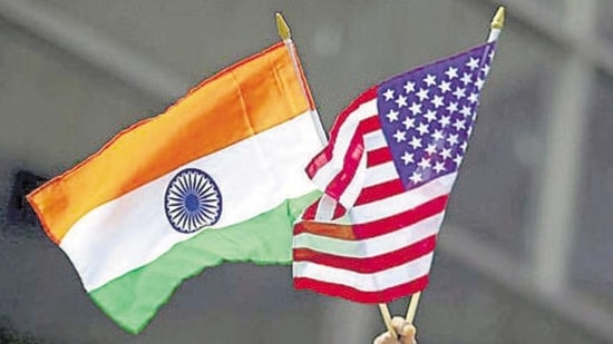 A man holds the flags of India and the US. (REUTERS)