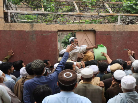 Chaos erupts outside flour distribution centre in Peshawar as police fire tear gas shells