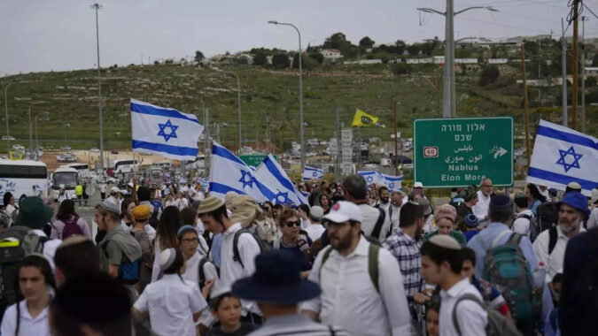 Palestinian Teen Killed In Army Raid: Palestinian teen killed in army raid as settlers hold march