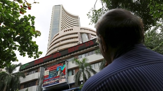 A man looks at a screen across a road displaying the Sensex on the facade of the Bombay Stock Exchange (BSE) building in Mumbai, India. (File image)(REUTERS)