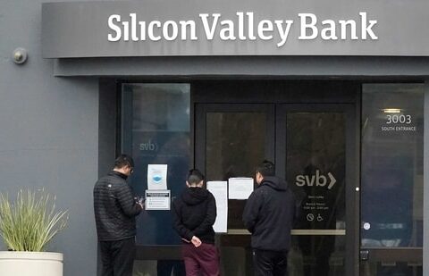 People look at signs posted outside of an entrance to Silicon Valley Bank in Santa Clara, California.(AP)