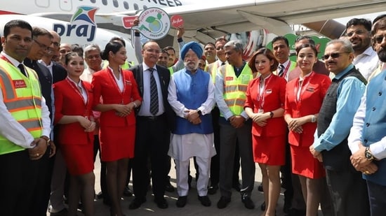 Union minister Hardeep Singh Puri with the crew of the historic AIX Connect flight.