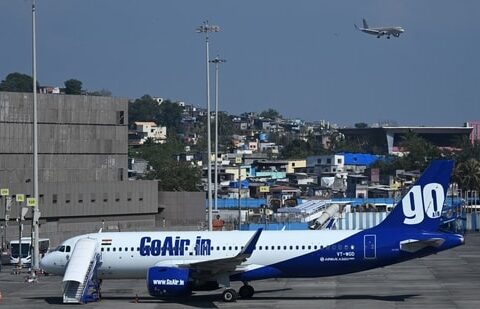 A Go First airline aircraft, formerly known as GoAir, is seen parked at the apron of the Mumbai International airport on May 3, 2023.(AFP)