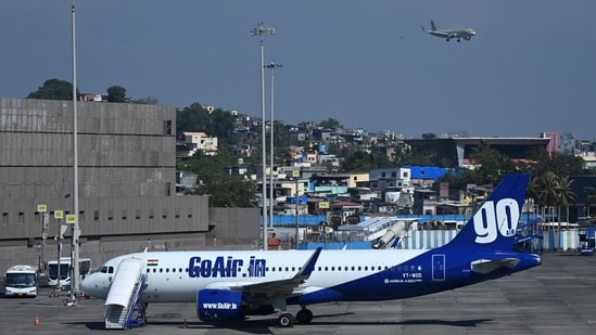 A Go First airline aircraft, formerly known as GoAir, is seen parked at the apron of the Mumbai International airport on May 3, 2023.(AFP)