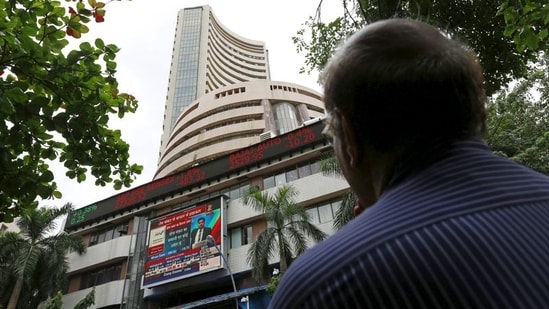 A man looks at a screen across a road displaying the Sensex on the facade of the Bombay Stock Exchange (BSE) building in Mumbai, India. (File image)(REUTERS)