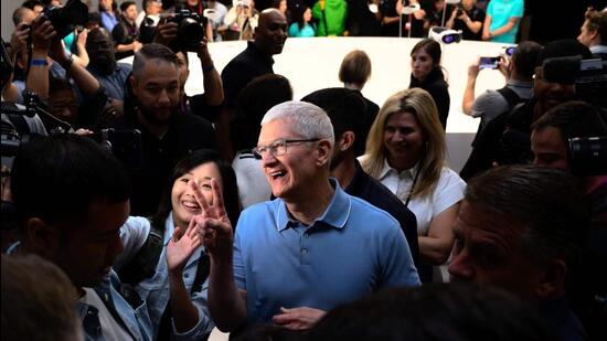 Apple CEO Tim Cook takes a photo in a viewing area for new products during Apple’s Worldwide Developers Conference (WWDC) at the Apple Park campus in Cupertino, California, on June 5. (AFP)