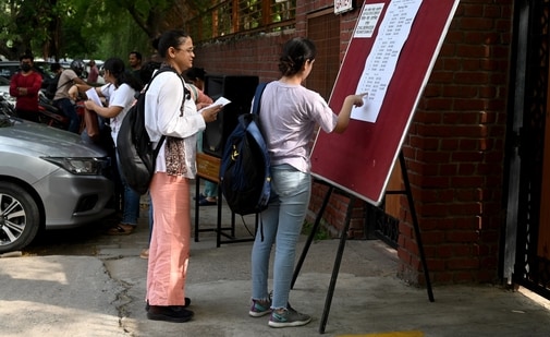 Aspirants queue for UPSC preliminary exam in Delhi.