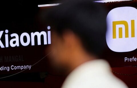 A man walks past a logo of Xiaomi, a Chinese manufacturer of consumer electronics, outside a shop in Mumbai,(REUTERS)