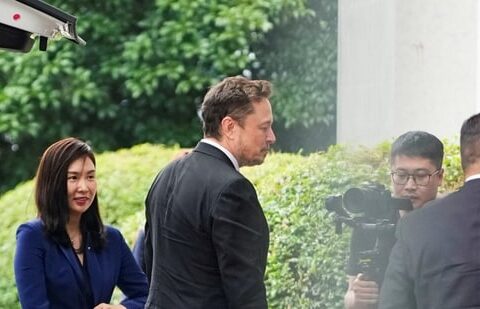 Tesla Chief Executive Officer Elon Musk walks at Shanghai Hongqiao International Airport in Shanghai.(Reuters)