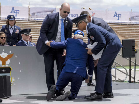 Joe Biden trips and falls on stage during Air Force graduation ceremony