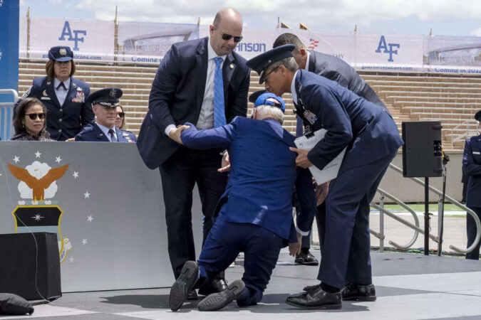 Joe Biden trips and falls on stage during Air Force graduation ceremony