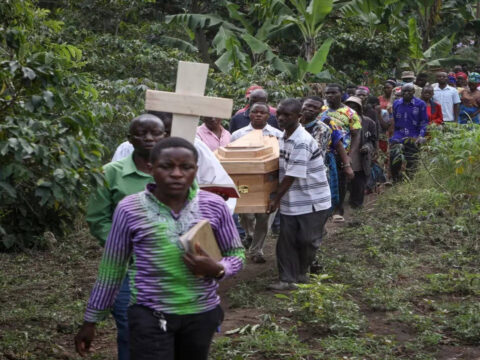 Ugandan border town buries victims of rebel massacre that left 42 dead, mostly students