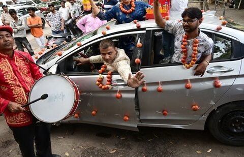 Chandigarh Youth congress workers with Tomato garlands, petrol bottles gift raps and car decoration with Tomato mark protest against rising inflation. Photo by Ravi Kumar/Hindustan Times