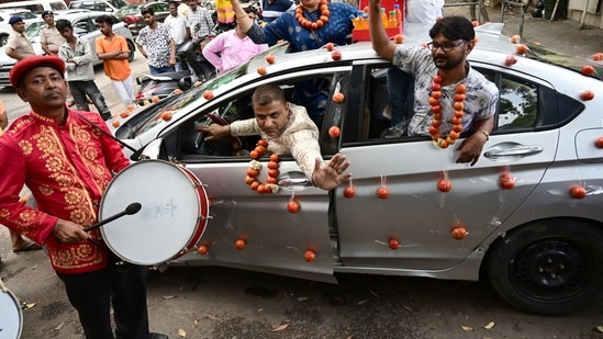 Chandigarh Youth congress workers with Tomato garlands, petrol bottles gift raps and car decoration with Tomato mark protest against rising inflation. Photo by Ravi Kumar/Hindustan Times