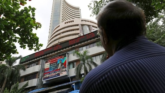 A man looks at a screen across a road displaying the Sensex on the facade of the Bombay Stock Exchange (BSE) building in Mumbai, India. (File image)(REUTERS)