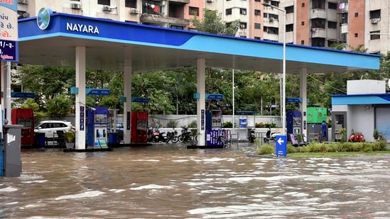 Surat: A waterlogged petrol pump following heavy rainfall,(PTI)