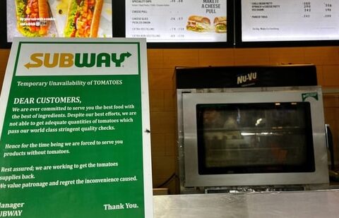 A notice on the temporary unavailability of tomatoes is seen at a Subway outlet at an airport terminal in New Delhi, India, July 22.(REUTERS)