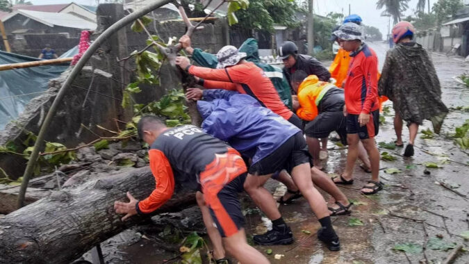 Typhoon blows off roofs, floods villages and displaces thousands in northern Philippines