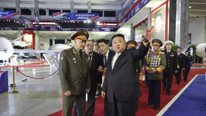 Kim Jong Un: North Korea shows off ballistic missiles, drones at night-time parade