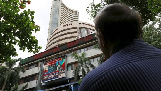 A man looks at a screen across a road displaying the Sensex on the facade of the Bombay Stock Exchange (BSE) building in Mumbai, India. (File image)(REUTERS)