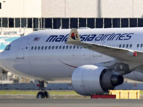 A passenger has been charged in Australia with allegedly threatening to blow up an airliner