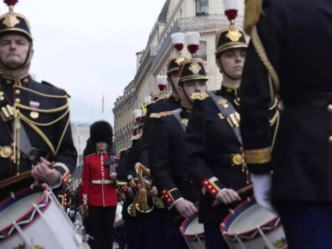 British, French troops march in historic joint parades in London and Paris in a show of solidarity