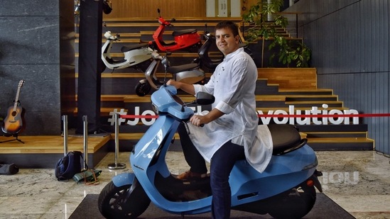 Ola Electric IPO: Bhavish Aggarwal, Co-founder and CEO of Ola, poses with the Ola electric scooter at the Ola headquarters in Bangalore.