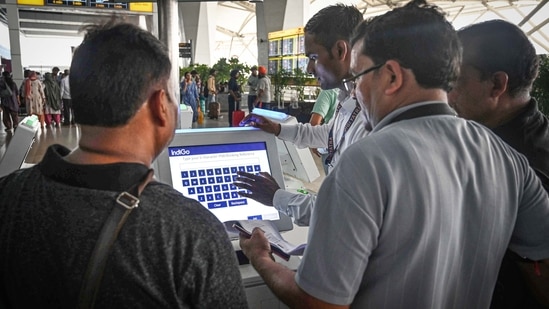 Passengers seen waiting after a major disruption in Microsoft Corp.'s cloud services caused widespread flight cancellations and delays at T3 IGI Airport in New Delhi, India, on Friday.(Vipin Kumar/ Hindustan Times)