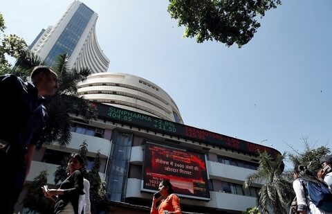 People walk past the Bombay Stock Exchange (BSE) building in Mumbai (Francis Mascarenhas/Reuters)