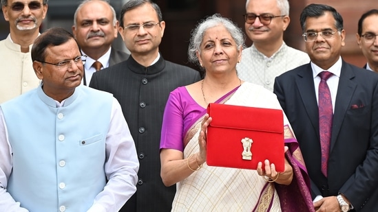 Union Finance Minister Nirmala Sitharaman showcases a red pouch carrying the Budget documents (Photo by Arvind Yadav/ Hindustan Times)(Hindustan Times)