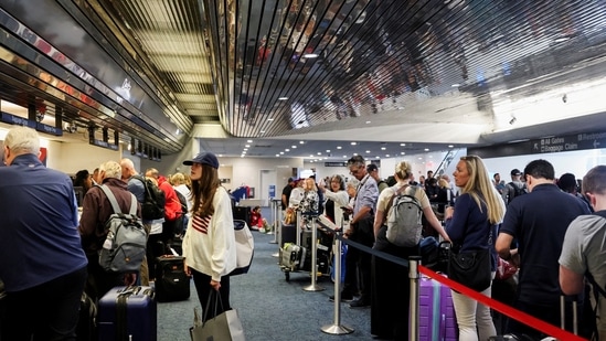 Microsoft Global Outage Live Updates: Passengers wait at Milwaukee Mitchell International Airport, after airlines grounded flights due to a worldwide tech outage caused by an update to CrowdStrike's "Falcon Sensor" software which crashed Microsoft Windows systems.