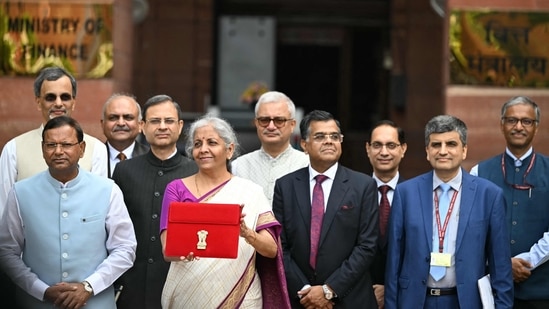 Finance minister Nirmala Sitharaman poses for photos before her budget speech. (AFP)