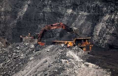 A loader loads coal in the truck at an open cast coal field at Topa coal mine in the Ramgarh district in the eastern Indian state of Jharkhand, India, February 27, 2024. (Amit Dave/Reuters)